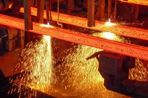 glowing steel at a continuous caster in a steel mill